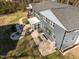 Aerial view of a home's backyard with a patio seating area and fire pit feature at 1603 N Alston Ave, Durham, NC 27701