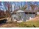 Spacious backyard with an outdoor seating area, fire pit, and dining space perfect for entertaining at 1603 N Alston Ave, Durham, NC 27701