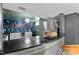 Finished basement with a bar featuring modern décor, including LED lighting, and built in appliances at 1603 N Alston Ave, Durham, NC 27701