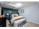 Basement bedroom with neutral carpet and stylish décor, including a decorative bench at 1603 N Alston Ave, Durham, NC 27701