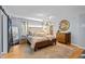 Serene bedroom with elegant furnishings, a large bed, and stylish lighting fixtures at 1603 N Alston Ave, Durham, NC 27701