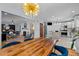 View of the dining room featuring a wooden table, blue chairs, and the living room at 1603 N Alston Ave, Durham, NC 27701