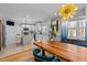 Dining area adjacent to the kitchen featuring modern lighting and an island at 1603 N Alston Ave, Durham, NC 27701