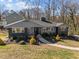 Inviting exterior of a modern home features a landscaped yard, stylish entry, and neutral colors at 1603 N Alston Ave, Durham, NC 27701