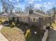 Stylish gray home with brickwork, well-manicured lawn, and convenient driveway access at the rear at 1603 N Alston Ave, Durham, NC 27701