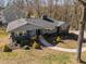Aerial view of charming home with lush front yard and mature trees at 1603 N Alston Ave, Durham, NC 27701