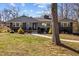 Charming single-story home with inviting front yard and manicured landscaping at 1603 N Alston Ave, Durham, NC 27701
