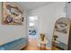 Hallway featuring hardwood floors, stylish furniture, and an open doorway to a bedroom at 1603 N Alston Ave, Durham, NC 27701