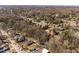 Aerial view of the neighborhood showing the home's setting amongst mature trees and other houses at 1603 N Alston Ave, Durham, NC 27701