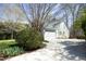 Spacious driveway leading to a well-maintained home with mature trees offering ample shade at 1705 Mcrae Pl, Hillsborough, NC 27278