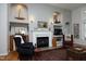 Inviting living room featuring a fireplace, built-in shelving, and classic decor at 1705 Mcrae Pl, Hillsborough, NC 27278