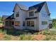 New two-story home featuring large windows and a covered porch at 171 Dairymont Dr, Pittsboro, NC 27312