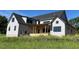 Rear exterior of a new two-story home with a covered porch at 171 Dairymont Dr, Pittsboro, NC 27312