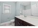 Cozy bathroom featuring a large mirror, vanity, and toilet at 200 Mariah Towns Way, Garner, NC 27529