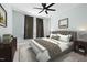 Bedroom boasts a neutral color palette, plush bedding, and a ceiling fan at 200 Mariah Towns Way, Garner, NC 27529