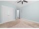 Bedroom features a double door closet, neutral walls, and a carpeted floor at 200 Mariah Towns Way, Garner, NC 27529