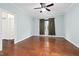Spacious bedroom with hardwood floors, ceiling fan, and a closet space at 200 Mariah Towns Way, Garner, NC 27529