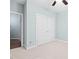 The bedroom features neutral carpet, light-blue walls, a ceiling fan, and a closet at 200 Mariah Towns Way, Garner, NC 27529