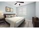 Bedroom features a bed, window, and nightstands at 200 Mariah Towns Way, Garner, NC 27529