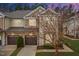 Charming townhome featuring stone accents, a private garage, and beautifully landscaped surroundings at 200 Mariah Towns Way, Garner, NC 27529