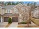 Charming townhome featuring stone accents, a private garage, and beautifully landscaped surroundings at 200 Mariah Towns Way, Garner, NC 27529