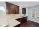 Well-appointed kitchen featuring granite countertops, stainless steel appliances, and dark wood cabinetry at 200 Mariah Towns Way, Garner, NC 27529