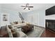 Bright and airy living room with a fireplace, stairs, and double doors that let in natural light at 200 Mariah Towns Way, Garner, NC 27529