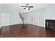 Spacious living room with hardwood floors, fireplace, staircase, and double doors leading outside at 200 Mariah Towns Way, Garner, NC 27529