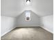 Finished attic space with carpet and a window, offering extra living area at 2012 Castana Ct, Willow Springs, NC 27592