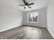 Sunlit bedroom featuring clean walls, stylish flooring, large window and ceiling fan at 2012 Castana Ct, Willow Springs, NC 27592