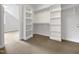 Walk-in closet featuring built-in shelving and ample hanging space at 2012 Castana Ct, Willow Springs, NC 27592