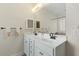 Bright bathroom with double sink vanity, a large mirror, and plenty of cabinet space at 203 Streamside Dr, Sanford, NC 27330