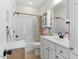 A clean and functional bathroom with a tub/shower, vanity, and neutral color scheme at 203 Streamside Dr, Sanford, NC 27330