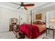 Traditional style bedroom with a four poster bed, side table and decorative elements at 203 Streamside Dr, Sanford, NC 27330
