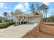 Beautiful home with a well-manicured lawn, driveway, garage, and covered front porch at 203 Streamside Dr, Sanford, NC 27330