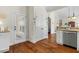 Functional kitchen area boasting wood floors, an access door, and seamlessly connecting to the living room at 203 Streamside Dr, Sanford, NC 27330