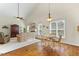 Spacious living room with vaulted ceilings, hardwood floors, and a fireplace perfect for entertaining at 203 Streamside Dr, Sanford, NC 27330