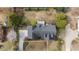 Aerial view of the property, showing the layout of the house, driveway, and surrounding landscaping at 205 Parliament Pl, Dunn, NC 28334