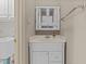 Charming bathroom features white vanity with sink, mirrored medicine cabinet, and towel bar at 205 Parliament Pl, Dunn, NC 28334