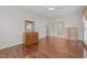 Bright primary bedroom boasts hardwood floors, neutral walls, and plenty of closet space at 205 Parliament Pl, Dunn, NC 28334