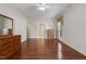 Spacious bedroom with hardwood floors, large window, and neutral color palette at 205 Parliament Pl, Dunn, NC 28334