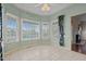 Charming breakfast nook with ample windows, providing lots of natural light, neutral walls, and tile floors at 205 Parliament Pl, Dunn, NC 28334