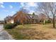 Beautiful brick home with manicured landscaping, offering a welcoming and classic curb appeal at 205 Parliament Pl, Dunn, NC 28334