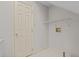 The laundry room features a utility sink, storage shelf and hookups for a washer and dryer at 205 Parliament Pl, Dunn, NC 28334