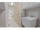This laundry room offers utility sink and tile floors at 205 Parliament Pl, Dunn, NC 28334