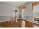 Elegant living room showcasing hardwood floors, soft gray walls, and classic chandelier lighting at 205 Parliament Pl, Dunn, NC 28334