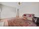 Comfortable living room with a decorative rug, hardwood floors, sofa, and a neutral color scheme at 205 Parliament Pl, Dunn, NC 28334