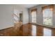 Cozy living room with beautiful hardwood floors and large windows providing natural light at 205 Parliament Pl, Dunn, NC 28334
