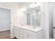 Modern bathroom featuring double sinks, framed mirror, and shower room at 207 Golfview Ave, Benson, NC 27504
