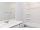 Bright bathroom features a white vanity with solid surface counters and a tub/shower combo at 207 Golfview Ave, Benson, NC 27504